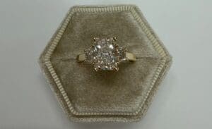 Diamond engagement ring in hexagonal velvet box