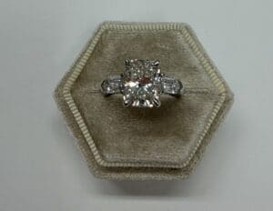 Diamond engagement ring in hexagonal velvet box