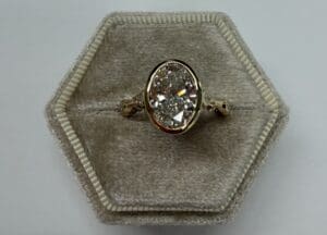 Oval engagement ring in hexagonal velvet box