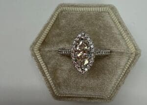 Marquise diamond halo engagement ring in velvet box