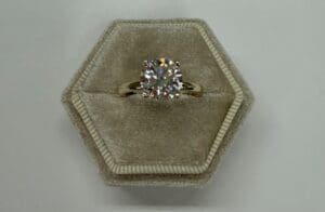 Diamond engagement ring in hexagonal velvet box